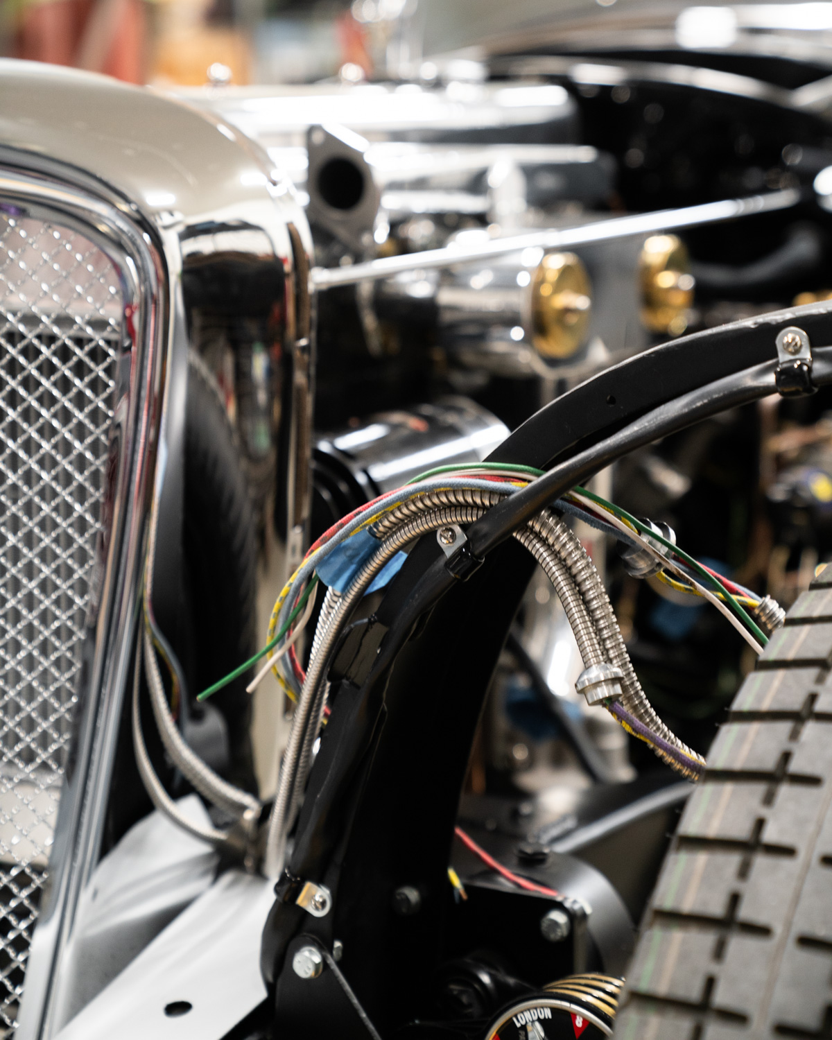 wiring being tidied up over wheel arch